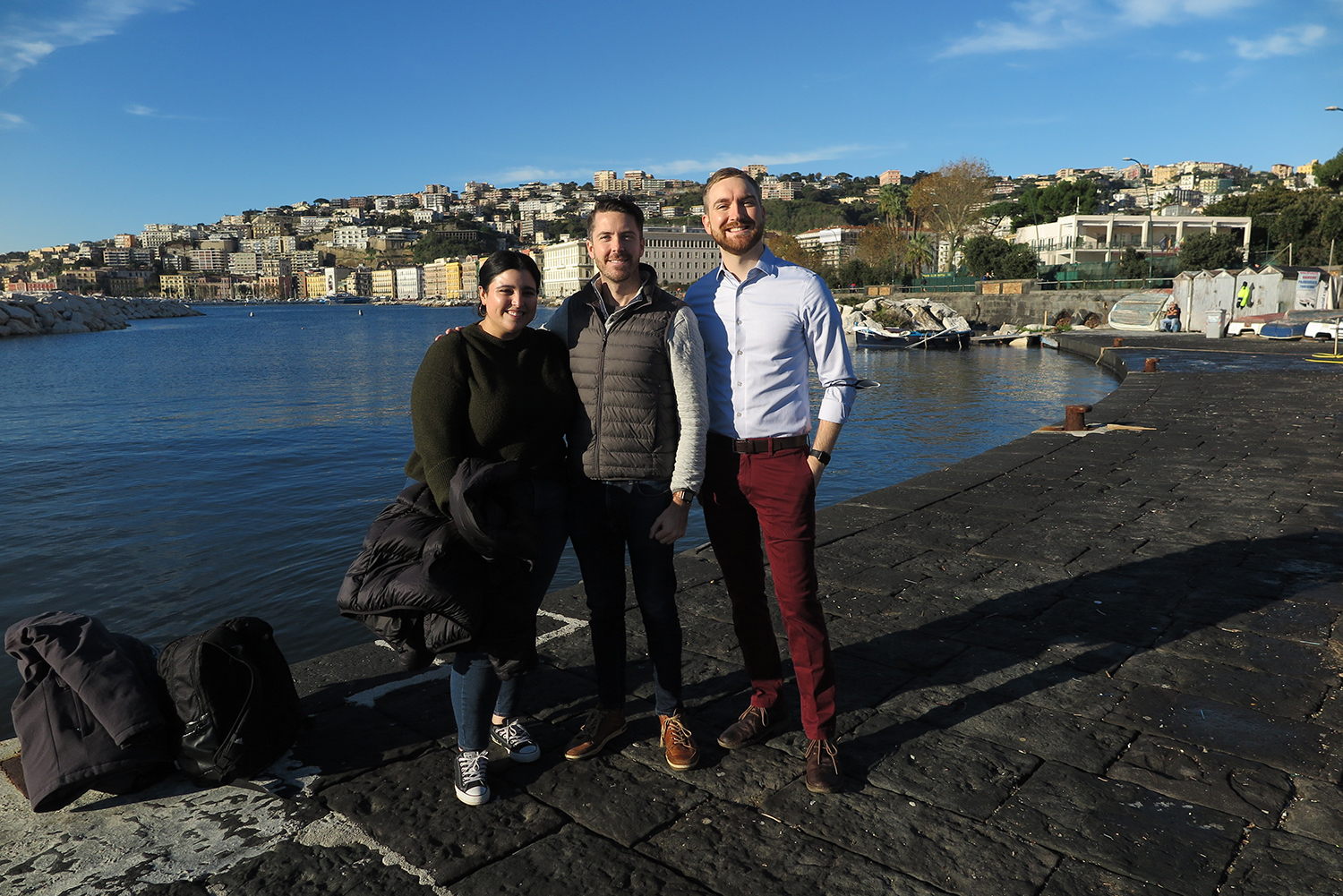 <p><span><span><span><span>Project team members Arianne Kouri, Kevin Kelly, and Ross McClellan&nbsp;pictured in front of the consulate in Naples. Photograph: RAMSA, 2021.</span></span></span></span></p>

